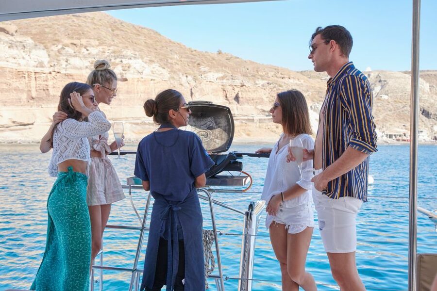 Santorini Gold Catamaran Cruise with Snorkel, BBQ & Open Bar - Wine, music, and the sunset atmosphere