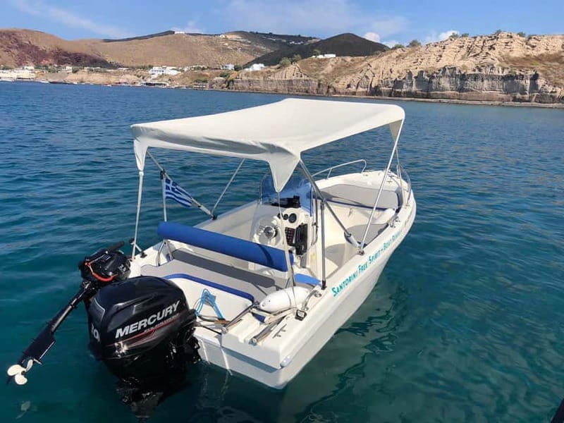 Santorini: License-Free Boat Rental with Ice, Water, & Fruit - Taking the wheel from the pier by Notos Hotel
