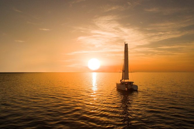 Santorini Luxury Catamaran Sunset Cruise with BBQ, Drink and Transfer - White Beach, BBQ, and the longest stop