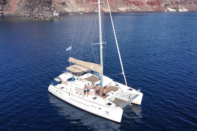 Santorini Platinum Catamaran Cruise with Meal, BBQ and Open Bar - Sunset departures add atmosphere, not extra sightseeing