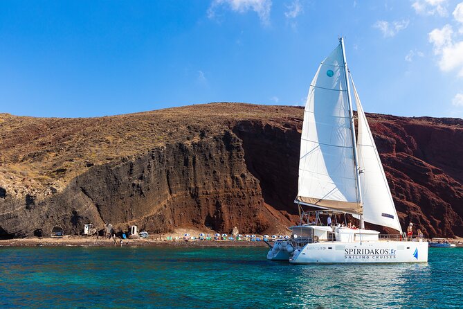 Santorini Private Catamaran Cruise with BBQ, Open Bar & Transfers - Red Beach: a quick look at Santorini’s volcanic colors
