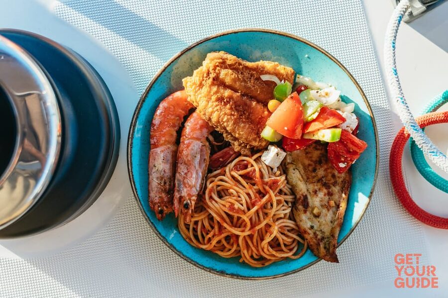 Santorini: Private Catamaran Tour with BBQ Meal and Drinks - What the catamaran feels like onboard