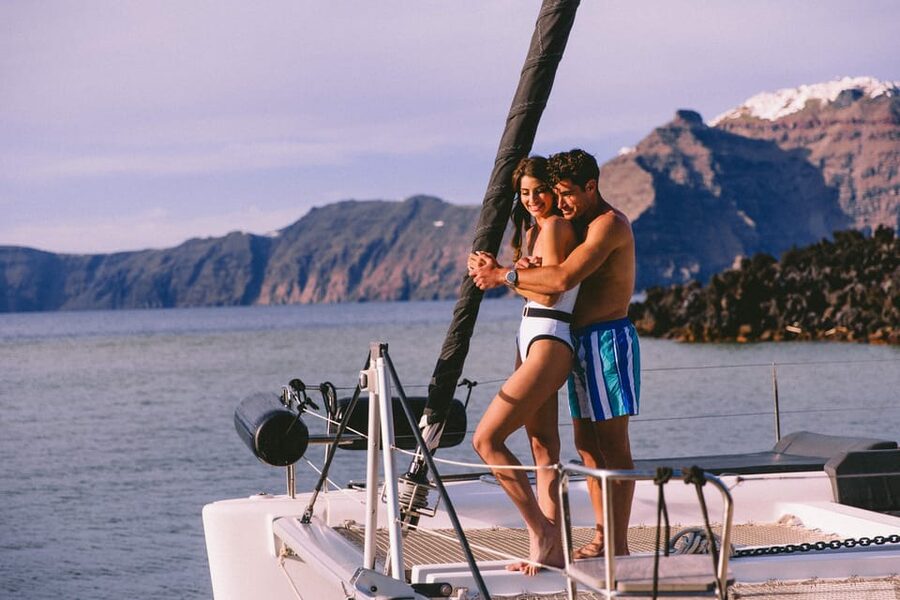 Santorini: Private Catamaran Tour with BBQ Meal and Drinks - Leaving Vlychada for Red Beach
