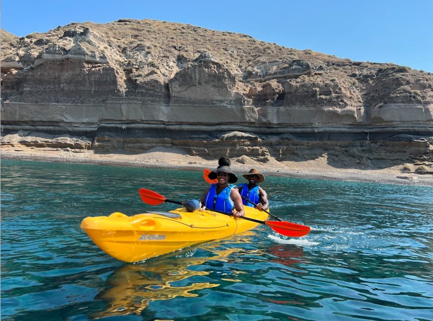 Santorini: Sea Caves Kayak Trip with Snorkeling and Picnic - The White Beach cliff jump