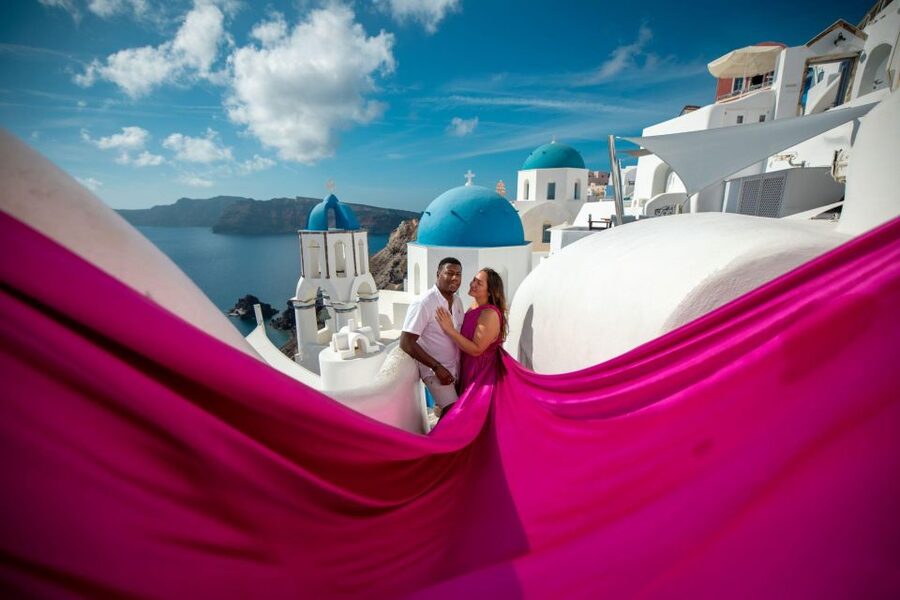 Santorini: Unique Flying Dress Photoshoot Experience - Oia’s Blue Domes Give the Session Its Signature Look