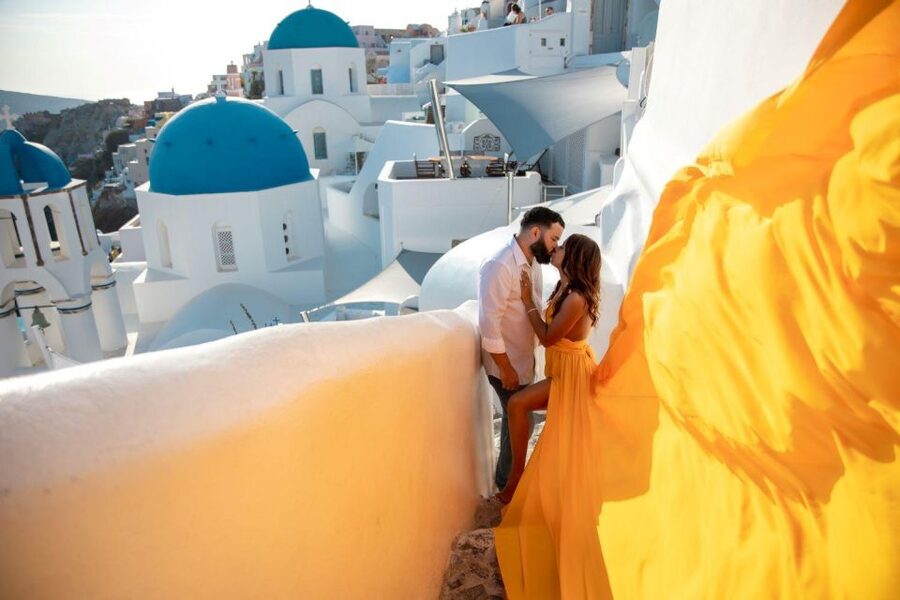 Santorini: Unique Flying Dress Photoshoot Experience - Walking Through the Oia Photo Stop