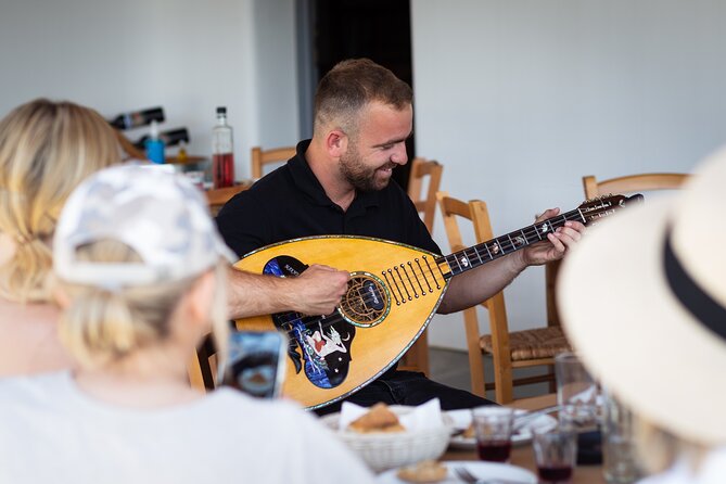 Tour and Wine Tasting in Mykonian Land - Wine, olive oil, and a full table