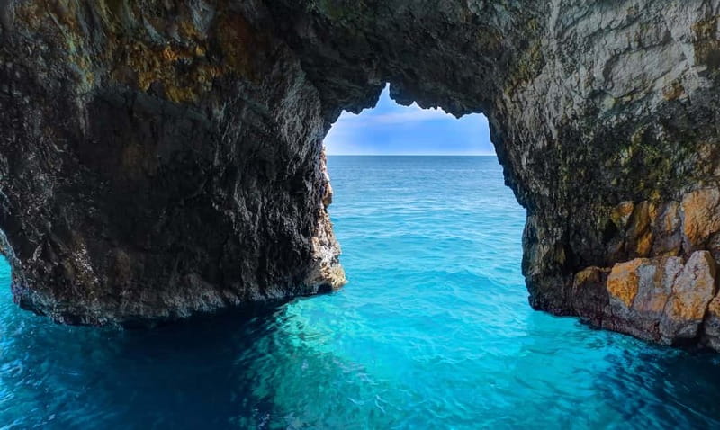 Zakynthos: Turtle Spotting Cruise with Glass-Bottom Boat - Swimming beneath the cliffs